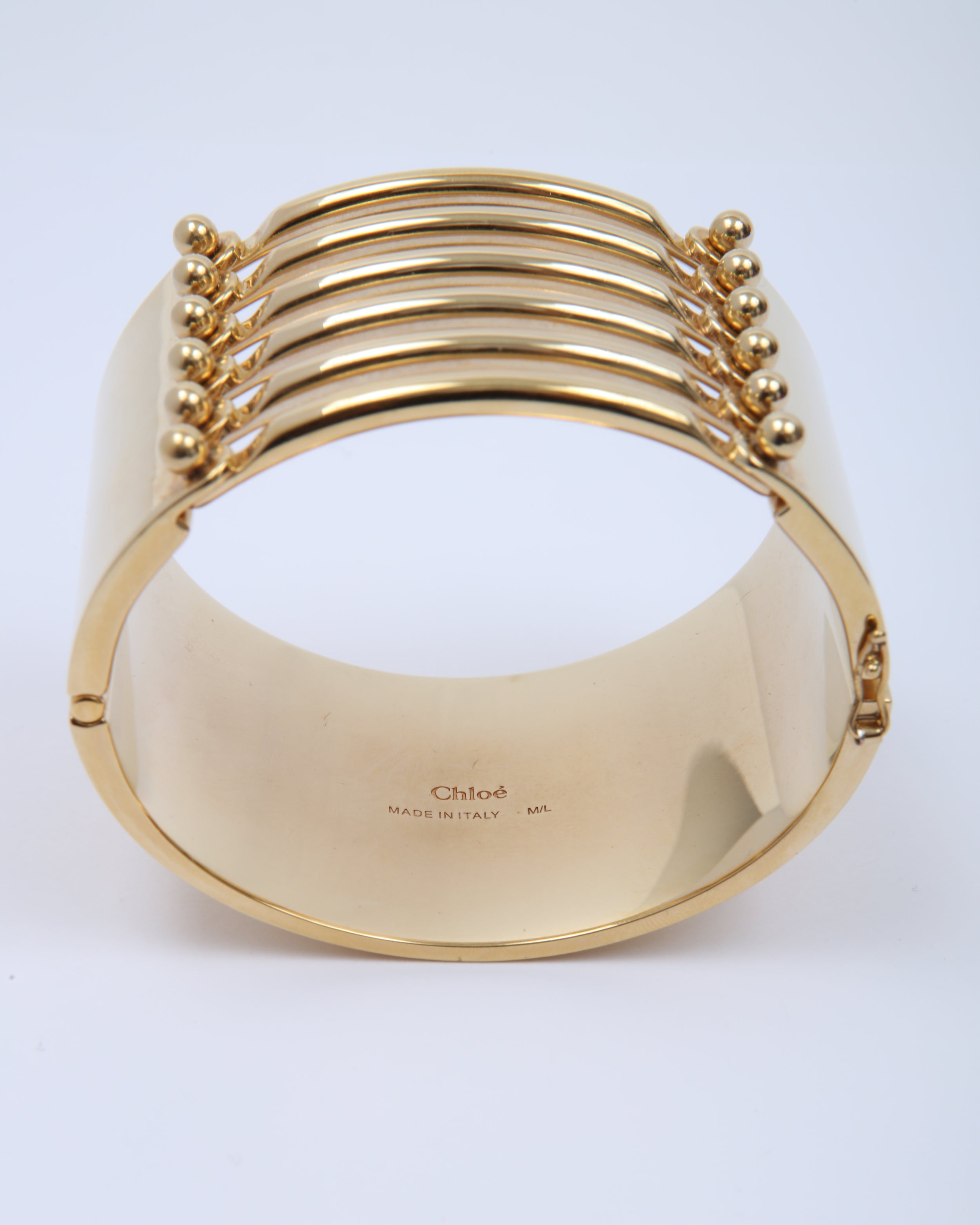 Explore a Chloe Gold Wide Bangle Bracelet - Authenticated Pre