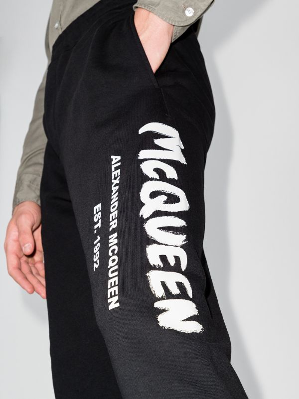 Alexander McQueen Logo Graffiti Print Track Pants | Black | FARFETCH