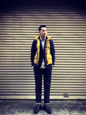 STONE ISLANDのダウンベスト（イエロー系）を使った人気ファッション