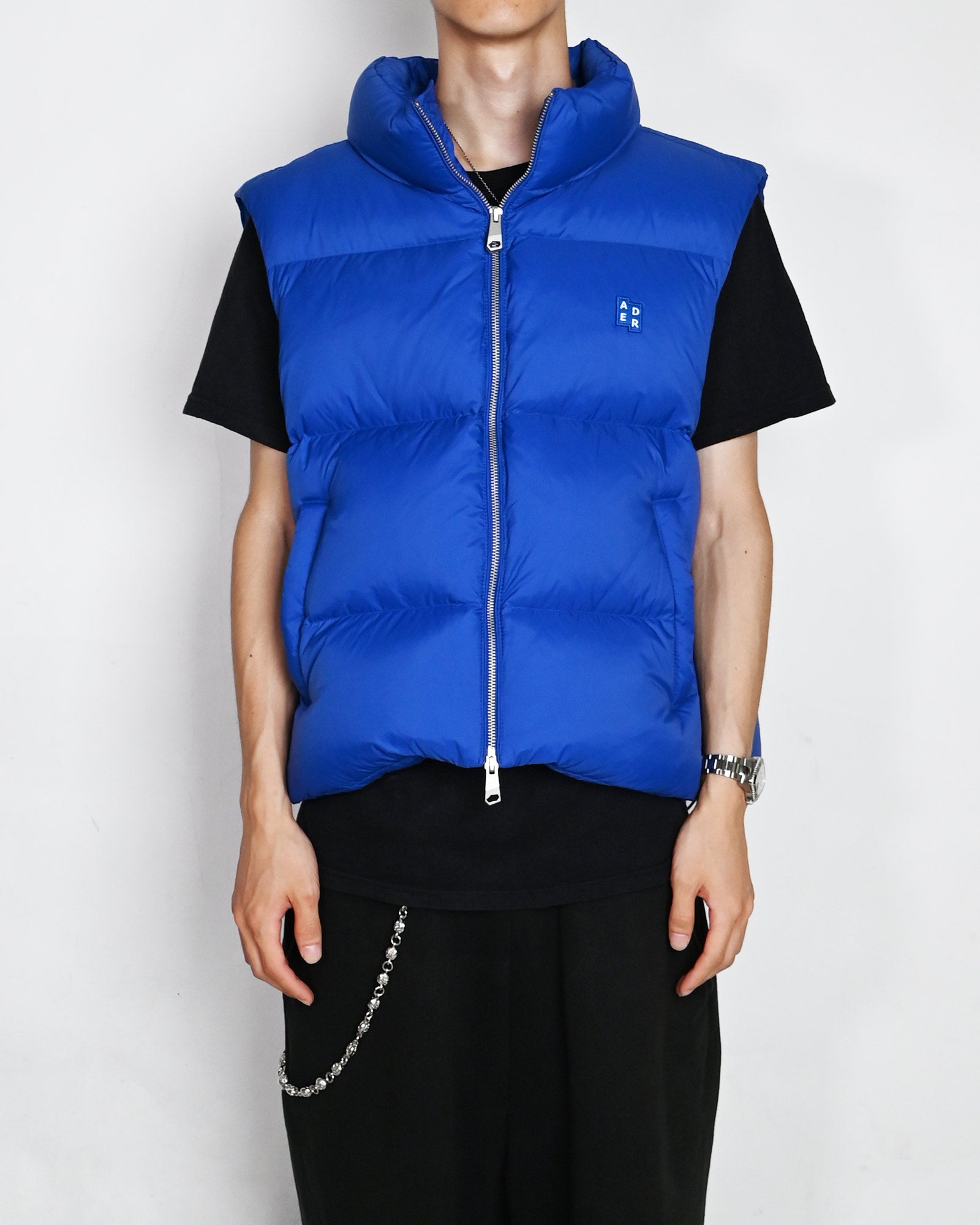 Ader Error(アーダーエラー)「 TRS TAG PUFFER VEST 01 / BLUE