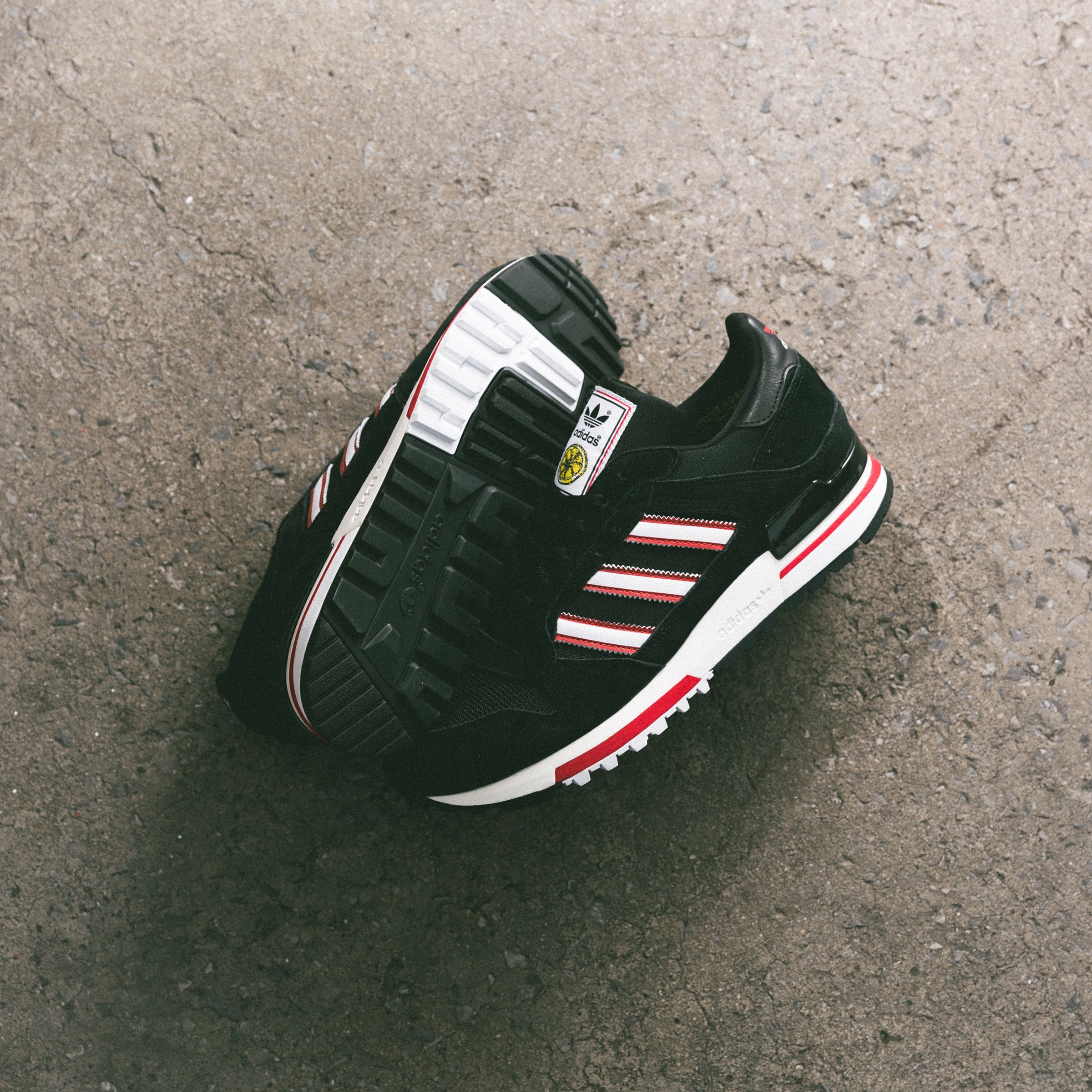 Buy Manchester United x adidas Stone Roses ZX 600 Trainers Black