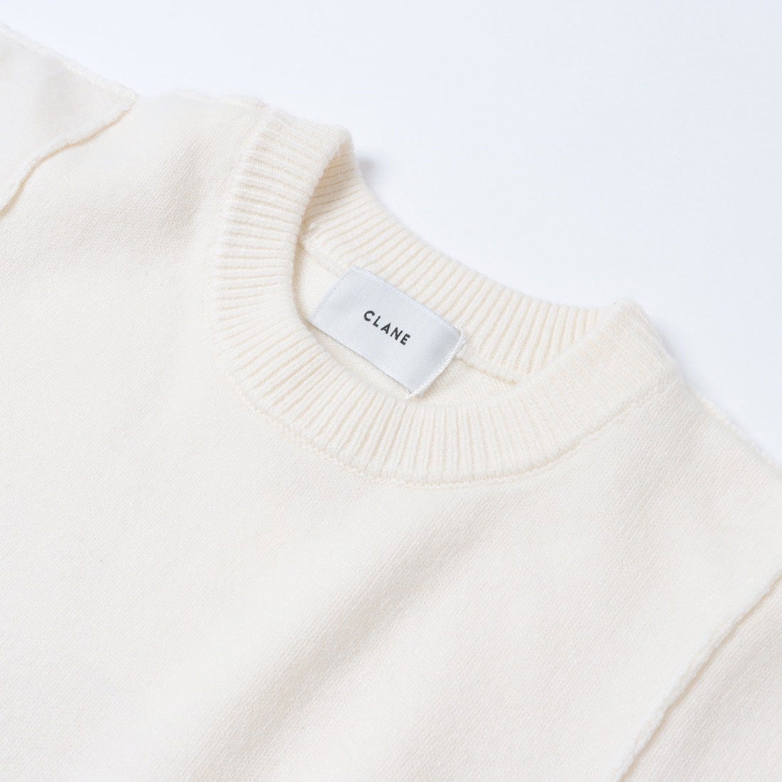 クラネ CLANE DOCKING POWERSHOULDER KNIT TOPS （IVORY