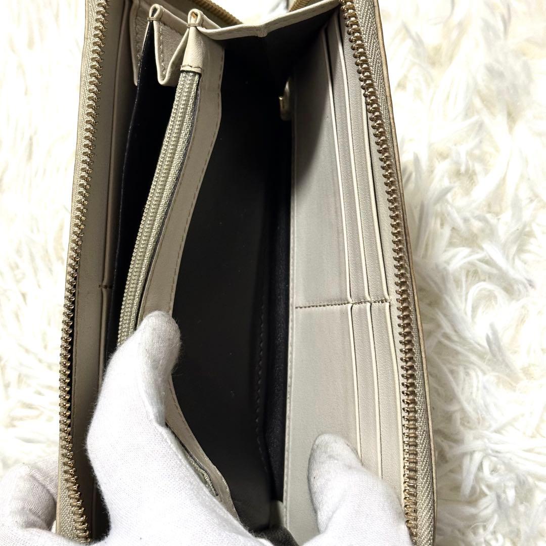 GUCCI 長財布 ラウンドジップ シマ 金プレート 型押し レザー ホワイト