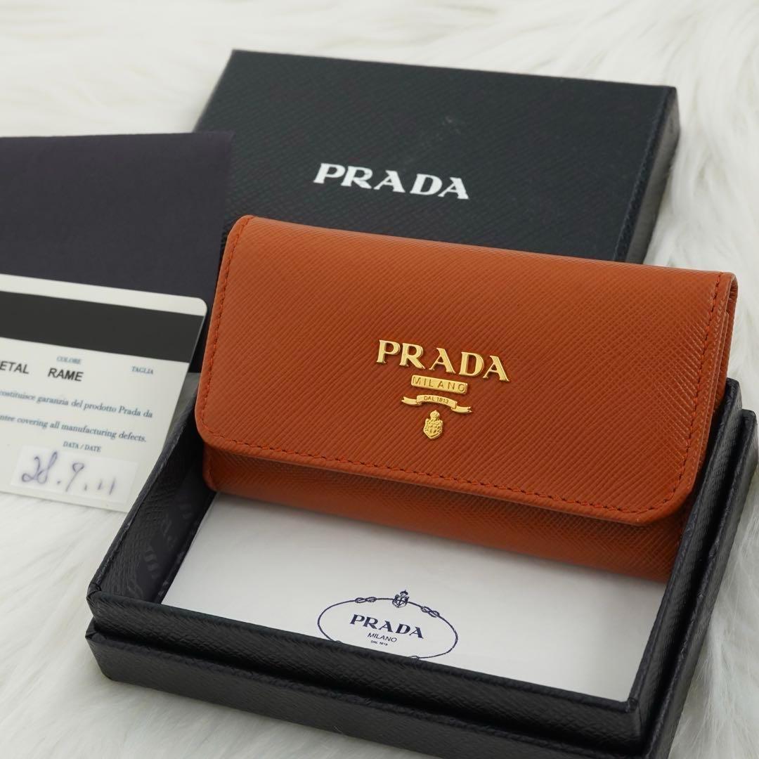 未使用級の状態　箱付き　PRADA プラダ　6連キーケース　ロゴグラム　オレンジ 楽天市場】PRADA プラダ 6連キーケース SAFFIANO ナイロン CORALLO