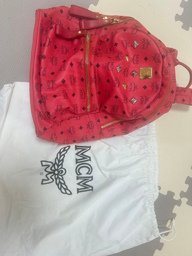 MCM 赤 スタッズリュック ダストバッグ付き 中古・古着通販】MCM (エムシーエム) スタッズリュック｜ブランド