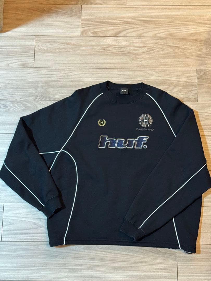 HUF ブラック ロゴ入り 長袖カットソー HUF（ハフ） メガブラスト ロングスリーブTシャツ MEGABLAST L/S TEE