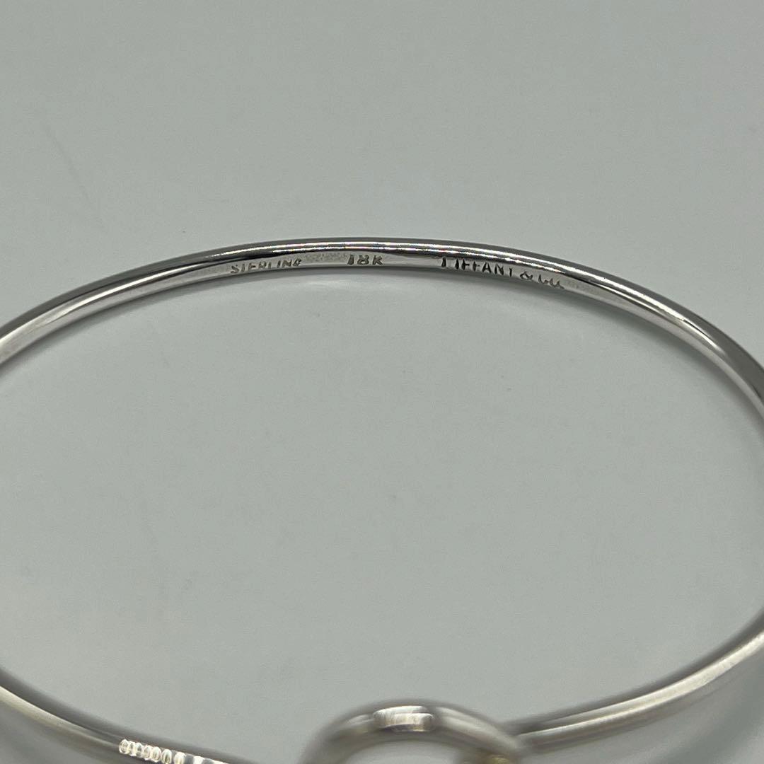 ティファニー TIFFANY ラブノット バングル SV YG コンビ - メルカリ