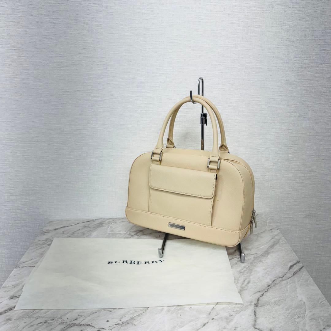 ✨BURBERRY✨バーバリー✨サファイアーノ✨レザー✨ベージュ✨ハンドバッグ✨ BURBERRY(バーバリー) Ivory Leather Knight Arc Handbag レザー