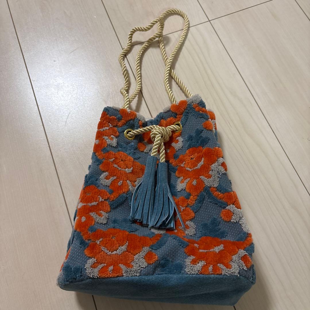 PUPU LAUKKU 金華山巾着　水色とオレンジのマグノリア　花柄巾着バック 金華山巾着 ＜水色オレンジのマグノリア＞ | PUPU LAUKKU ププラウック