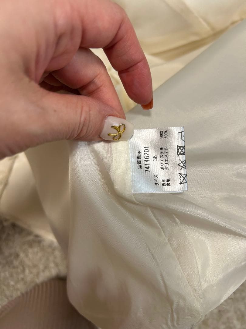 CADUNEカデュネ リボンヤーンペプラムジレ - メルカリ