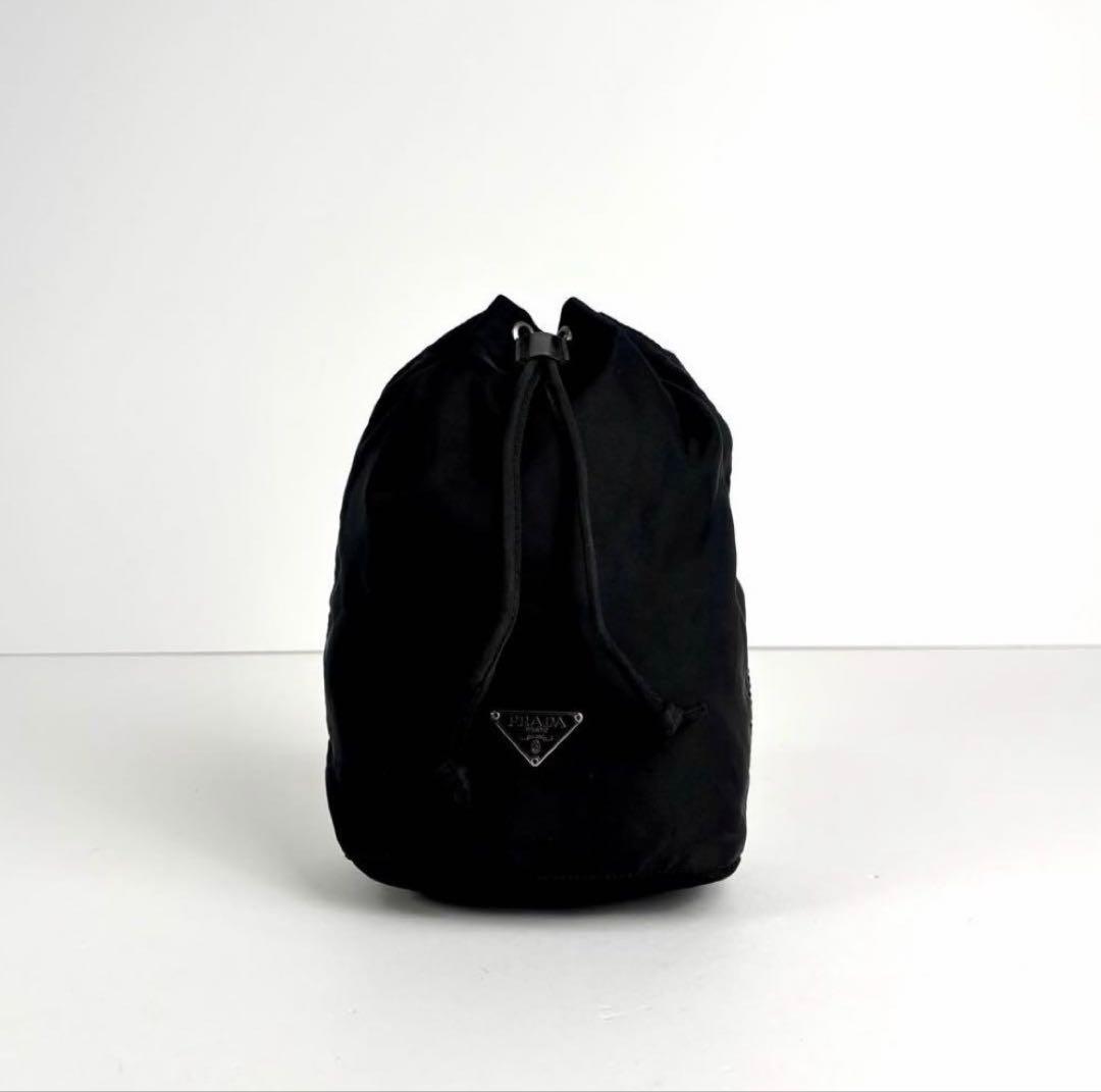 PRADA巾着ポーチミニバック三角ロゴ - メルカリ